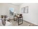 Cozy office space with a modern desk, comfortable chair, and natural light from a large window at 40189 Crooked Stick Dr # 1205, Lancaster, SC 29720