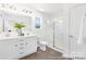 Modern bathroom featuring a double sink vanity and glass-enclosed shower at 40189 Crooked Stick Dr # 1235, Lancaster, SC 29720