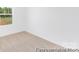 Bedroom showcasing a scenic window view and neutral carpet at 40189 Crooked Stick Dr # 1235, Lancaster, SC 29720