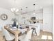 The dining room features stylish pendant lighting and flows into the kitchen, creating an inviting space at 40189 Crooked Stick Dr # 1235, Lancaster, SC 29720