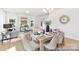 An open-concept dining area transitions to the living room, offering a versatile space for entertaining or relaxing at 40189 Crooked Stick Dr # 1235, Lancaster, SC 29720