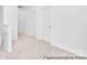 Upstairs hallway features neutral carpet and crisp white walls at 40189 Crooked Stick Dr # 1235, Lancaster, SC 29720