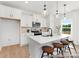 Bright kitchen with stainless steel appliances, a center island with bar seating, and ample counter space at 40189 Crooked Stick Dr # 1235, Lancaster, SC 29720