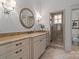This bathroom features a granite vanity top, decorative mirror, and modern glass walk-in shower at 4336 Tottenham Rd, Charlotte, NC 28226