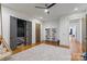 Bright bonus room features wood floors, neutral carpet, built-in shelving, and an adjacent media room at 4336 Tottenham Rd, Charlotte, NC 28226
