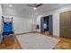 Bonus room/playroom with hardwood floors, a ceiling fan, an open doorway, and a swing chair at 4336 Tottenham Rd, Charlotte, NC 28226