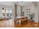 Bright dining area with large windows, modern furniture, and hardwood flooring at 4336 Tottenham Rd, Charlotte, NC 28226