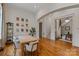 Inviting dining area with hardwood floors, stylish decor, and seamless access to other rooms at 4336 Tottenham Rd, Charlotte, NC 28226