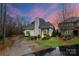 Stately two-story home with a dark roof, painted brick, mature landscaping, and an inviting front entrance at 4336 Tottenham Rd, Charlotte, NC 28226