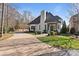 Beautiful single-Gathering home with painted brick, a well-manicured lawn, and a circular driveway at 4336 Tottenham Rd, Charlotte, NC 28226