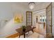 Bright home office featuring hardwood floors, stylish decor, and ample natural light at 4336 Tottenham Rd, Charlotte, NC 28226