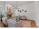 Stylish living room with fireplace, decorative chandelier, and neutral color palette at 4336 Tottenham Rd, Charlotte, NC 28226