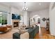Cozy living room with fireplace, ample seating, and access to other rooms at 4336 Tottenham Rd, Charlotte, NC 28226