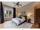 Comfortable main bedroom featuring a ceiling fan, neutral walls, and a decorative rug on the hardwood floors at 4336 Tottenham Rd, Charlotte, NC 28226