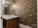 Chic powder room featuring floral wallpaper, elegant vanity, and modern fixtures at 4336 Tottenham Rd, Charlotte, NC 28226