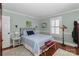 Comfortable bedroom features a queen bed, shutters, and neutral walls at 632 N Oakland Ave # Pt1, Statesville, NC 28677