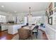 Bright dining area featuring a large bay window, chandelier, and a wooden table with seating at 632 N Oakland Ave # Pt1, Statesville, NC 28677