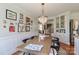 Open dining area with a chandelier, wood table, and decor; the entrance is visible in the background at 632 N Oakland Ave # Pt1, Statesville, NC 28677