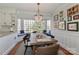 Charming dining area with a bay window and a chandelier, perfect for cozy meals and gatherings at 632 N Oakland Ave # Pt1, Statesville, NC 28677