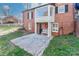 Charming brick home featuring an elevated porch with a bay window and white bench at 632 N Oakland Ave # Pt1, Statesville, NC 28677