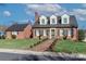 Charming brick home with dark shutters, dormer windows, and manicured front lawn, epitomizing curb appeal at 632 N Oakland Ave # Pt1, Statesville, NC 28677