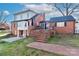 Rear exterior elevation featuring a brick facade, elevated porch, and outdoor patio at 632 N Oakland Ave # Pt1, Statesville, NC 28677