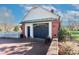 Garage with brick and white siding plus a blue garage door and driveway at 632 N Oakland Ave # Pt1, Statesville, NC 28677