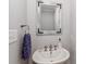 Quaint half bath with unique faucet, wall-mounted mirror, and a simple sink at 632 N Oakland Ave # Pt1, Statesville, NC 28677