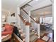Hallway with staircase leading to dining and kitchen, hardwood floors and natural light at 632 N Oakland Ave # Pt1, Statesville, NC 28677