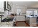 Spacious kitchen with stainless steel appliances, granite countertops, and white cabinetry, perfect for cooking at 632 N Oakland Ave # Pt1, Statesville, NC 28677