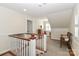 Light filled upstairs landing features a quaint chair and shuttered windows at 632 N Oakland Ave # Pt1, Statesville, NC 28677