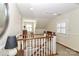 Bright upstairs landing filled with natural light, wood railing and furniture at 632 N Oakland Ave # Pt1, Statesville, NC 28677