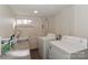 Functional laundry room with stainless steel sink and side by side washer and dryer at 632 N Oakland Ave # Pt1, Statesville, NC 28677