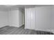 The basement is spacious with modern gray wood-look flooring, white walls, trim, and closet space at 7526 Dorn Cir, Charlotte, NC 28212