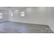 Finished basement featuring recessed lighting, wood look flooring, and natural light from windows at 7526 Dorn Cir, Charlotte, NC 28212