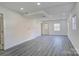 Finished basement featuring recessed lighting, wood look flooring, and glass paneled door at 7526 Dorn Cir, Charlotte, NC 28212