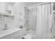 Stylish bathroom features white marble tile shower and ample storage with modern fixtures at 7526 Dorn Cir, Charlotte, NC 28212