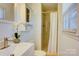 Bathroom featuring a modern vanity, tiled shower with glass door, and a bright, airy feel at 7526 Dorn Cir, Charlotte, NC 28212