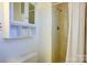 Bathroom featuring a modern shower with tiled walls, vanity, and a bright, airy feel at 7526 Dorn Cir, Charlotte, NC 28212