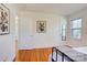 Bedroom featuring hardwood floors, neutral decor, window for natural light and iron bed frame at 7526 Dorn Cir, Charlotte, NC 28212