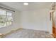 Bright dining room features a large window with natural light and neutral tile floors at 7526 Dorn Cir, Charlotte, NC 28212