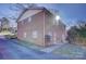 Brick apartment building with well-manicured landscaping and a paved driveway provides great curb appeal at 7526 Dorn Cir, Charlotte, NC 28212