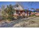 Charming brick home with manicured lawn and walkway leading to the front door at 7526 Dorn Cir, Charlotte, NC 28212