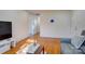 Bright living room with hardwood floors, comfortable seating, and ample natural light at 7526 Dorn Cir, Charlotte, NC 28212