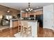 Open kitchen with breakfast bar and access to the living room at 1012 Preakness Blvd, Indian Trail, NC 28079