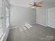 Bedroom with carpet, a ceiling fan, and natural light from a window at 10462 Trolley Run Dr, Cornelius, NC 28031