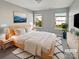 Bright, naturally lit bedroom with a minimalist design and a cozy, inviting ambiance at 10462 Trolley Run Dr, Cornelius, NC 28031