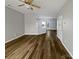 Inviting open-concept living area with hardwood floors, neutral walls, and natural light at 10462 Trolley Run Dr, Cornelius, NC 28031