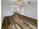 A spacious open concept living room features hardwood floors and neutral walls at 10462 Trolley Run Dr, Cornelius, NC 28031