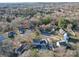 Aerial view of a residential neighborhood featuring mature trees and well-maintained lawns at 10929 Lassen Ct, Charlotte, NC 28214
